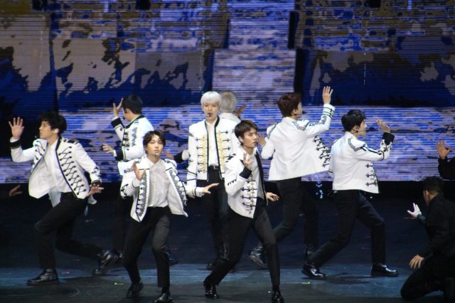 EXO showcasing their intricate choreography to their hits